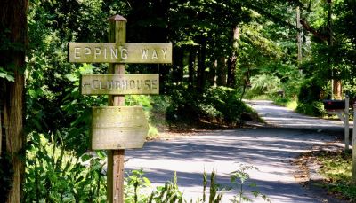 road with sign to Epping Way and Clubhouse